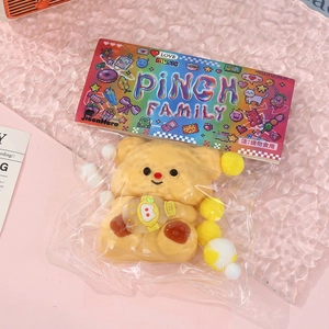 Cute yellow squishy bear with honey pot in original Pinch Family colorful packaging