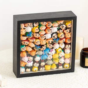 Detailed black wooden 3D display frame filled with various mini cartoon figure toys