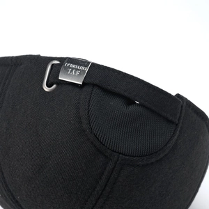 Detailed close-up of adjustable silver metal buckle on a black wool winter baseball cap