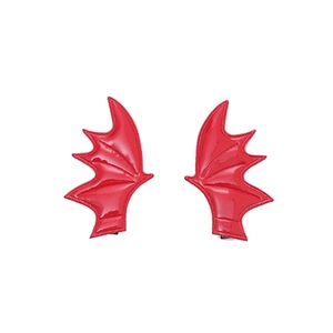 Pair of glossy red faux leather demon wing hair clips for Halloween party hair styling