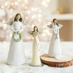 Three-piece set of white resin angel figurines with silver wings for Christmas decor