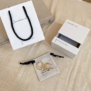 Elegant gold double hoop earrings set with luxury white paper bag and gift box packaging