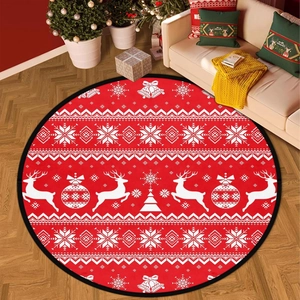 Detailed view of red round Christmas rug with white reindeer and snowflake patterns on wood floor