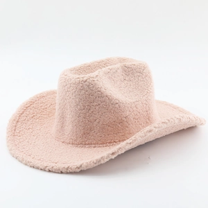 Detail of soft beige sherpa fleece texture on a warm vintage western cowboy hat