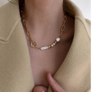 Modern mixed chain necklace with gold links, baroque pearls and toggle clasp closure