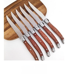 Set of 6 stainless steel steak knives with wood-style handles and triple rivet detail