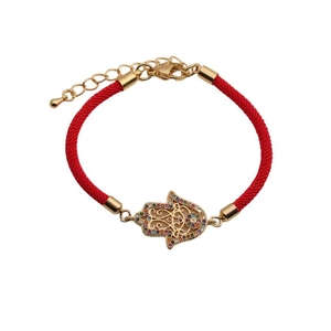 Red braided Hamsa Hand bracelet with gold pendant and colorful zircons on white background