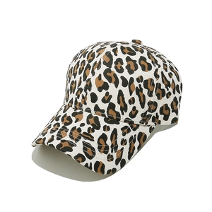Close-up of leopard print canvas fabric and textured stitching on the baseball cap