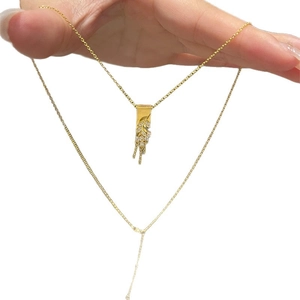 Double-layer gold plated necklace featuring a leaf pendant with zircon tassels on hands