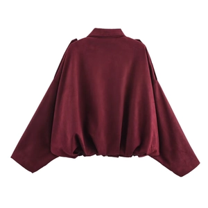 Back view of burgundy oversized bomber jacket featuring faux suede texture and ribbed hem