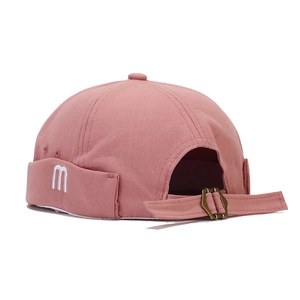 Retro brimless docker hat with 'm' embroidery and adjustable metal strap in dusty pink