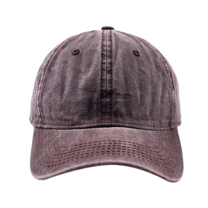 Detail of vintage washed dark brown cotton baseball cap with reinforced stitching lines