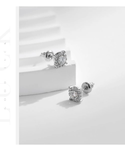 Macro shot of S925 sterling silver moissanite stud earrings with a four-prong halo design