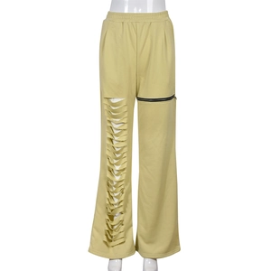Detail of high-waist ginger wide-leg pants featuring distressed cutout and zipper pocket