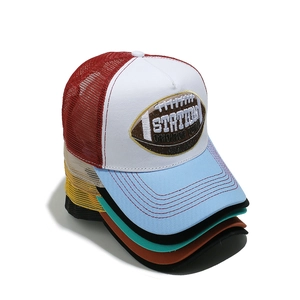 Stack of colorful mesh trucker hats featuring rugby embroidery and breathable back panels