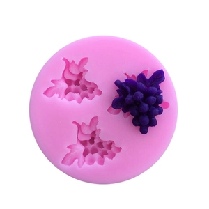 Pink silicone mold featuring grape cluster patterns for making fondant and chocolate decorations