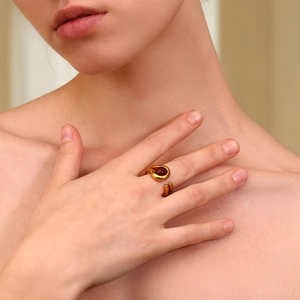 Close-up of 18K gold plated double layer ring featuring a warm amber gemstone