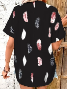 Detail of colorful feather print on black short-sleeve shirt fabric and texture