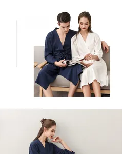 Detail of waffle knit couple robes in navy and white featuring premium textured fabric