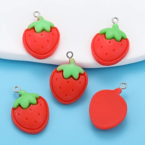 Detailed view of red resin strawberry charms for DIY jewelry making and keychains