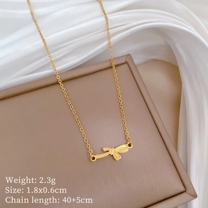 Detail view of gold bow necklace with dimensions 1.8x0.6cm and 40+5cm chain length