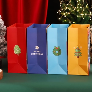 Christmas gift paper bags set with Merry Christmas text and festive holiday tree decorations