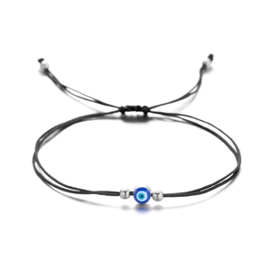 Handmade woven black string bracelet with blue evil eye bead and silver spacers