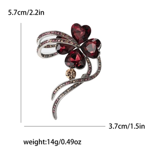 Elegant four-leaf clover brooch with red crystals and gold-tone finish 5.7cm size
