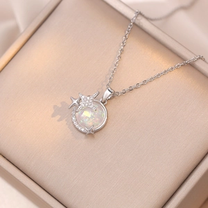 Star and moon planet pendant necklace with opal stone and silver steel chain in a jewelry box