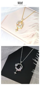 Detail of star and moon necklaces with gradient stones in gold and silver plating