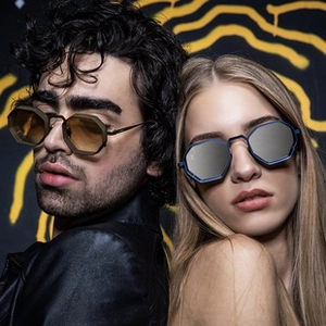 Close-up of octagonal rimless sunglasses on models with brown and silver lenses