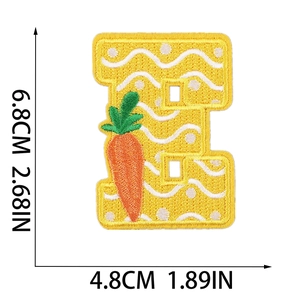 Detail of Easter letter E patch with yellow embroidery and carrot, 6.8x4.8cm dimensions