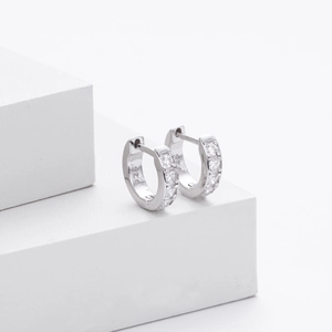 Macro detail of S925 sterling silver hoop earring with sparkling zircon stones