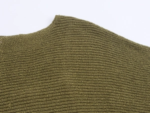 Close-up of olive green knit fabric texture with detailed horizontal ribbed stitching