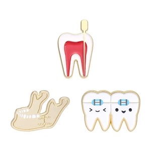 Dental enamel pin set featuring tooth anatomy, jaw bone, and cute braces tooth designs