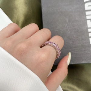 Close-up of S925 sterling silver eternity ring with pink square cut zircon gemstones