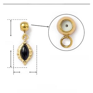 Detail view of 16mm gold heart pendant with black natural stone and rubber plug