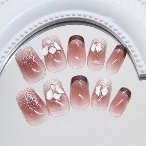 French red-brown glitter press-on nails with sparkling rhinestones and gradient design