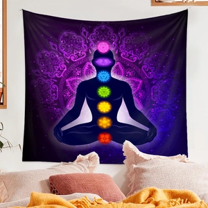 Detail view of seven chakra tapestry with mandala pattern and meditation silhouette