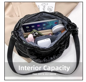Macro shot showing internal storage of black quilted crossbody bag with daily essentials