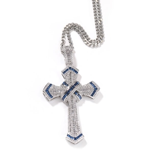 Close-up of hip hop cross pendant with blue and clear cubic zirconia on Cuban chain