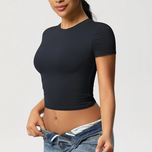 Close-up of black slim fit crop top T-shirt for yoga with short sleeves and crew neck