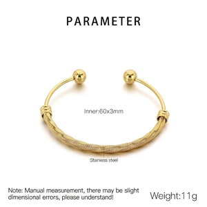 Detailed macro view of 18K gold plated mesh stainless steel bracelet with ball ends