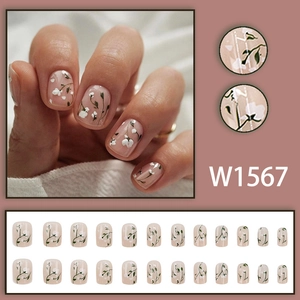 Floral press-on nails with white flowers and green vines on pink base, 24-piece nail set