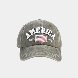 Detailed view of America embroidery and flag patch on washed vintage baseball cap
