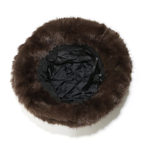 Detailed interior view of a brown winter faux fur bucket hat with thick quilted lining