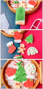 Detailed view of Christmas themed cookies with embossed patterns in a woven basket