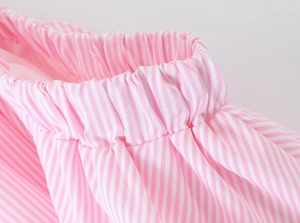 Close-up of pink and white vertical stripes on soft elasticated fabric texture