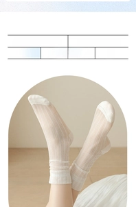 Close-up of white breathable mesh socks with vertical stripes and ruffled cuffs