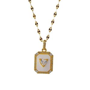 Elegant gold heart pendant necklace with white shell inlay and sparkling cubic zirconia